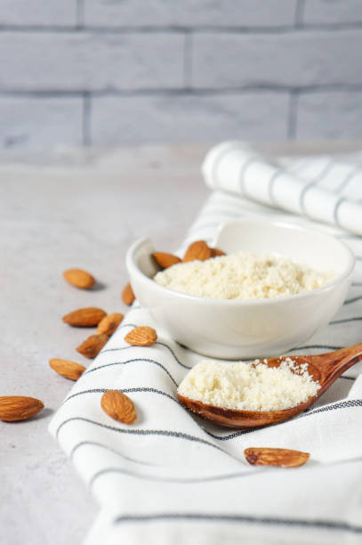 istock almond flour in a bowl and spoon with scattered nuts 1300876309