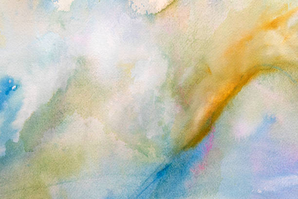 Colorful watercolor background with textures and splashes on white watercolor paper.  Blue, yellow, red. My own work.
