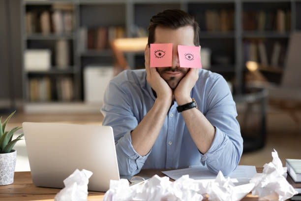 istock Unhappy young caucasian businessman feeling exhausted at workplace. 1300879279