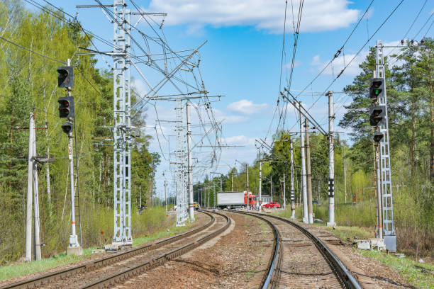 istock Cars cross the railway line. 1300880497