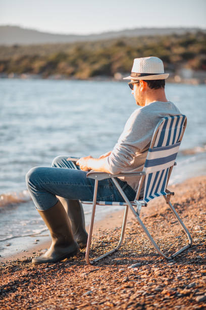 istock Young Man Spending Time on the Beach 1300880881