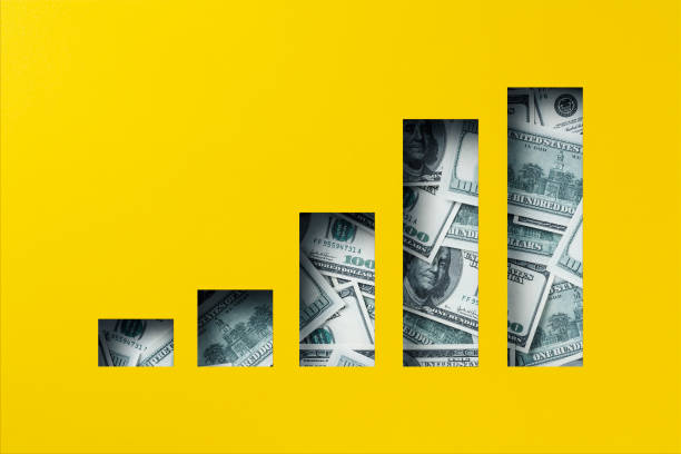 istock American dollar heap under paper cutout bar graph icon 1300882263
