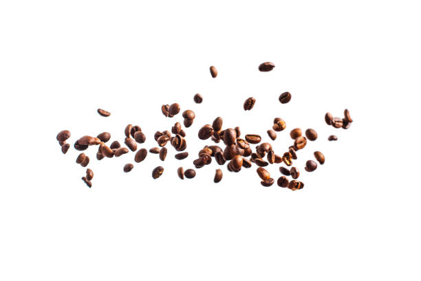 Coffee beans fly on white background stock photo