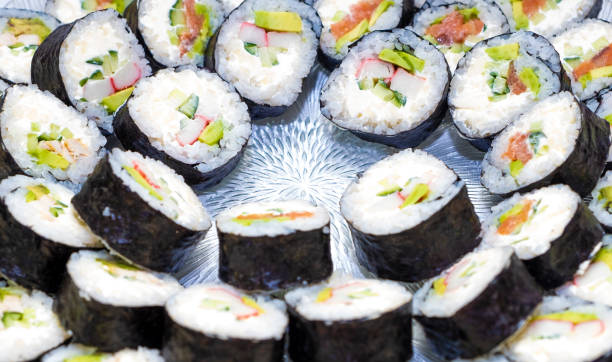 istock Ready dish, sushi rolls on a glass dish. Japanese kitchen. 1300884482