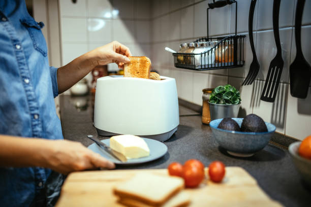 toast some bread,asian woman cooks in a kitchen