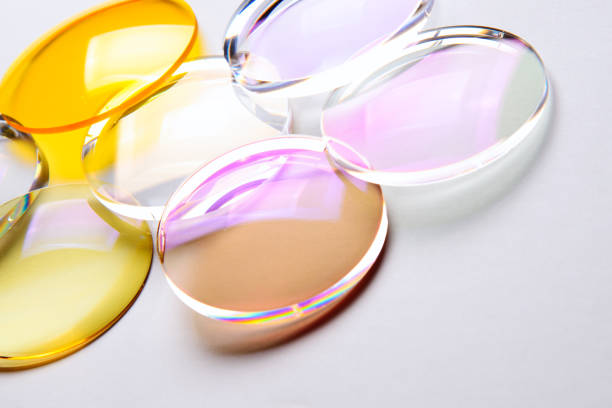 Lenses for medical Round lenses for glasses with anti-reflective coating on a white background. Production of glasses and spectacle lenses. lens eye stock pictures, royalty-free photos & images