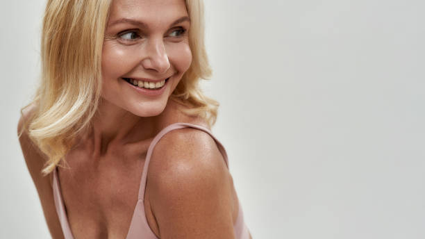 istock Smiling middle aged caucasian woman looking to side 1300885981