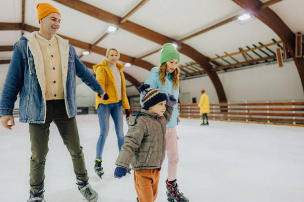 istock Family ice-skating 1300886739
