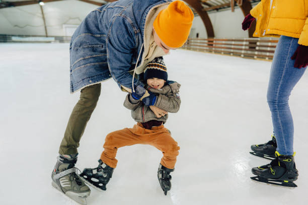 istock Family ice-skating 1300886758