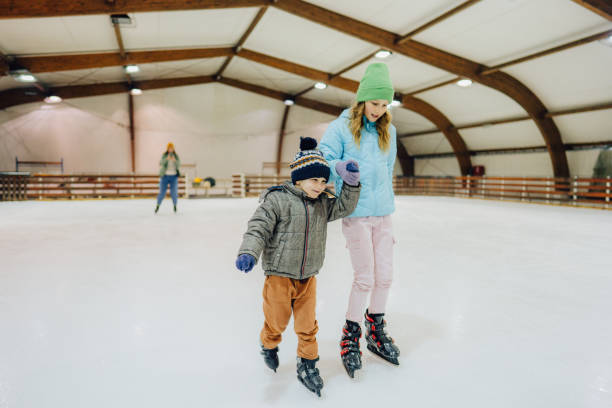 istock Ice-skating with my big sister 1300886838