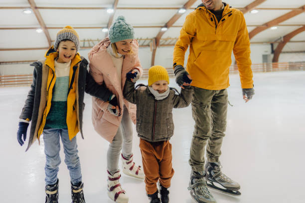 istock Family ice-skating 1300887016