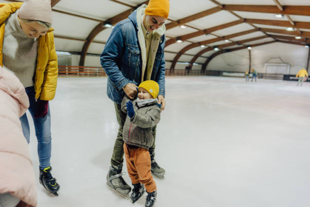 istock Little boy learning how to ice-skate 1300887046