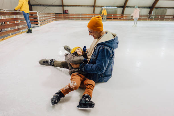 istock Funny accident on the ice-skating rink 1300887112