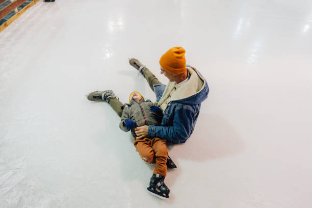 istock Funny accident on the ice-skating rink 1300887139
