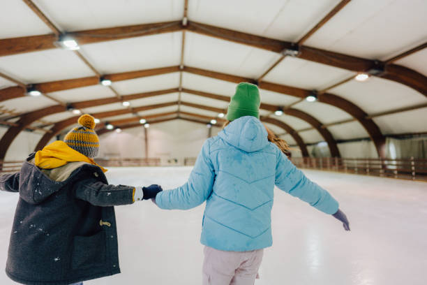 istock Ice-skating with my sister 1300887201