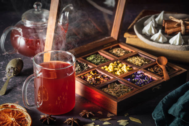 istock Red tea with a box of tea herbs and aromatic spices 1300887341