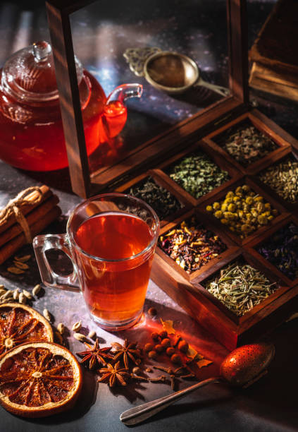 istock Red tea with a box of tea herbs and aromatic spices 1300887442