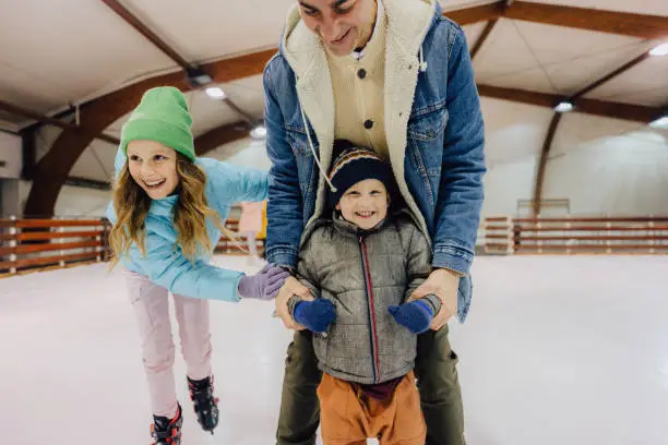 Photo of Learning how to ice-skate with my dad and sister