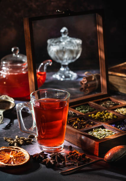 istock Red tea with a box of tea herbs and aromatic spices 1300887618
