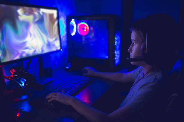 istock Gamer boy playing video games with his virtual teammates 1300889829