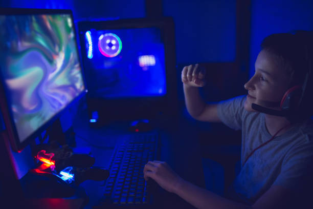 istock Gamer boy playing video games with his virtual teammates 1300889834