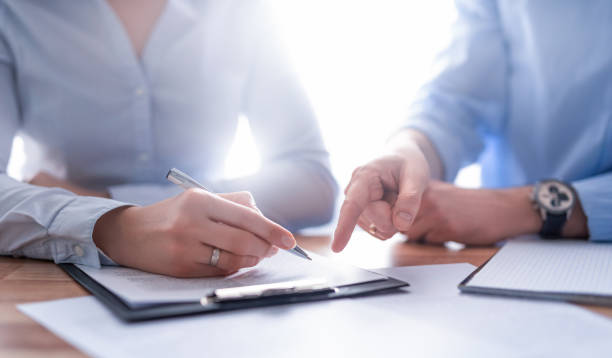 istock Business people negotiating a contract. 1300890805