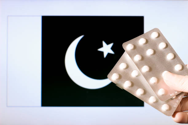 istock Hand in surgical glove holding pill blisters 1300890941