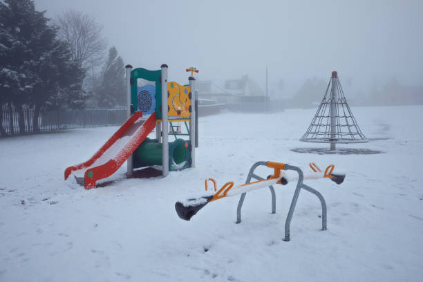 Empty winter colorful playground covered with snow