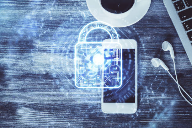 istock Double exposure of lock drawing over desktop. Top view. Security concept. 1300892718