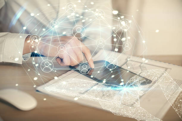 istock Double exposure of man's hands holding and using a phone and social network theme drawing. 1300892755