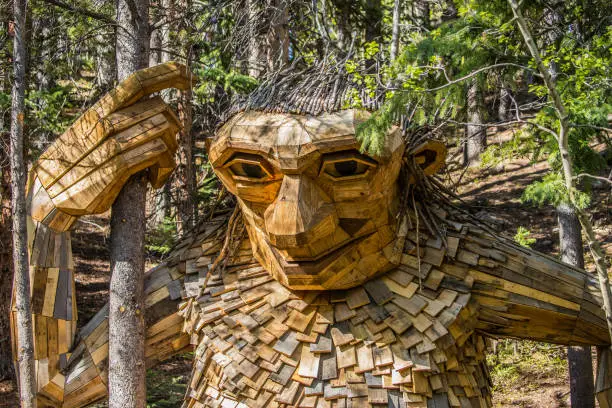 giant wooden woodland troll in forest
