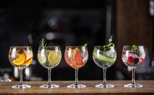 istock Gin tonic long drink as a classic cocktail in various forms with garnish in individual glasses such as orange, lemon, grapefruit, cucumber or berries. 1300893163