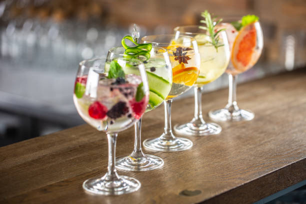 istock Gin tonic long drink as a classic cocktail in various forms with garnish in individual glasses such as orange, lemon, grapefruit, cucumber or berries. 1300893216