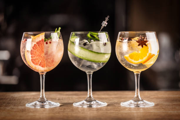 istock Gin tonic long drink as a classic cocktail in various forms with garnish in individual glasses such as orange, grapefruit, or cucumber. 1300893227