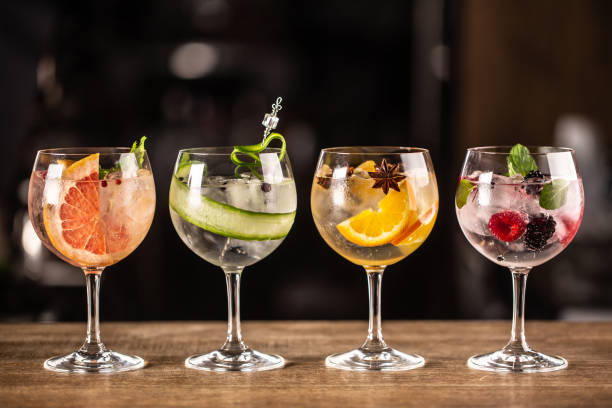 istock Gin tonic long drink as a classic cocktail in various forms with garnish in individual glasses such as orange, grapefruit, cucumber or berries. 1300893262