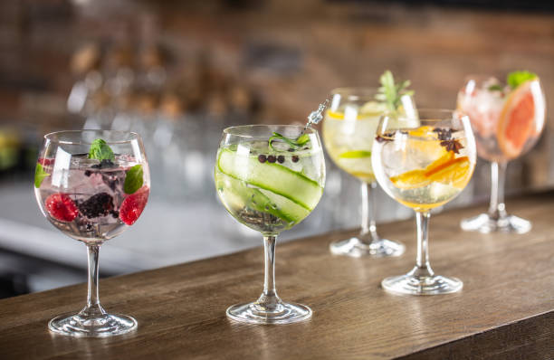 istock Gin tonic long drink as a classic cocktail in various forms with garnish in individual glasses such as orange, lemon, grapefruit, cucumber or berries. 1300893335