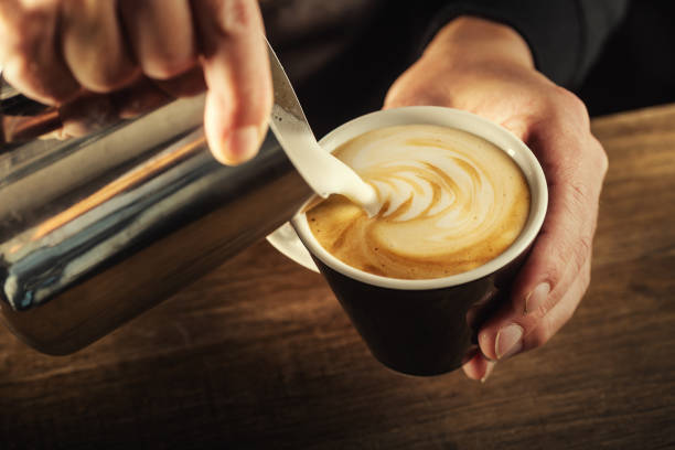 istock Milk foam poured into a  cup to form a perfect cappuccino. 1300893361