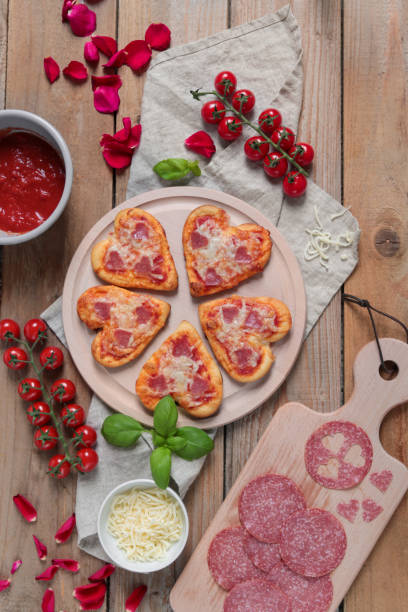 istock Mini Pizzas in heart shape for romantic Valentines Date 1300895183