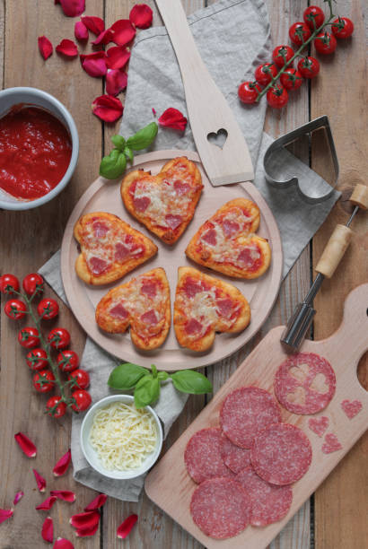 istock Mini Pizzas in heart shape for romantic Valentines Date 1300895216