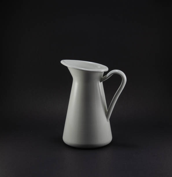 istock White metal jar on black background 1300895357