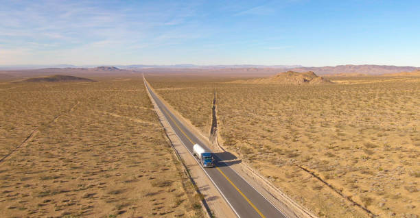 istock AERIAL: Big rig hauls a cistern across the rugged Mojave desert on a sunny day. 1300896174