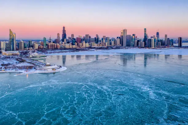 Photo of Chicago Skyline and Frozen Lake Michigan - Aerial View