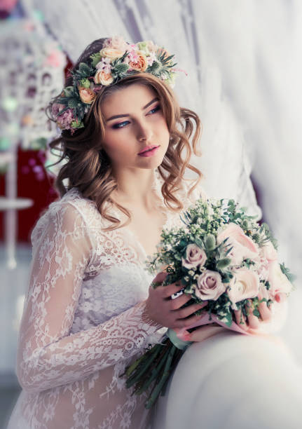 istock Gentle bride with flowers. Beautiful tender morning 1300897594