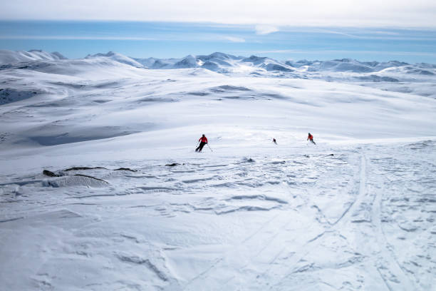 istock Three freeskiers making fresh tracks in Lapland mountain range Sweden 1300898385