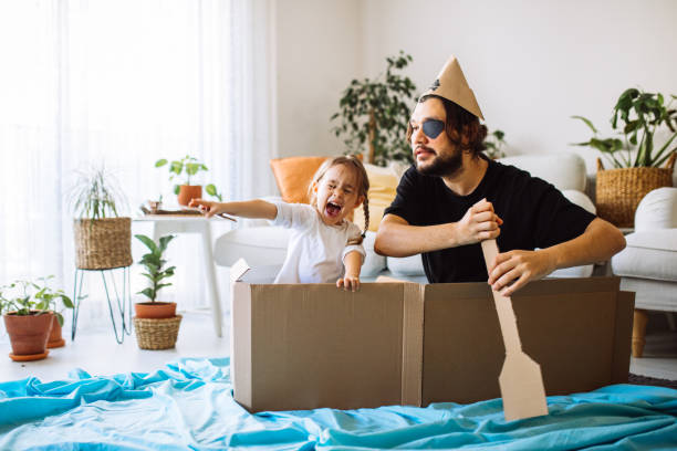 istock Father Playing Exciting Adventure Game With Daughter 1300900586