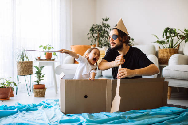 istock Father Playing Exciting Adventure Game With Daughter 1300900786