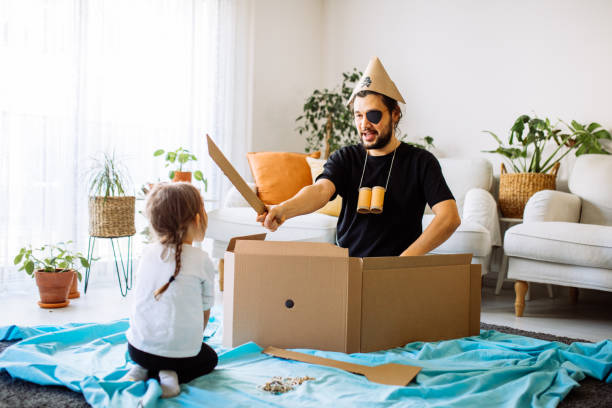 istock Father Playing Exciting Adventure Game With Daughter 1300901576