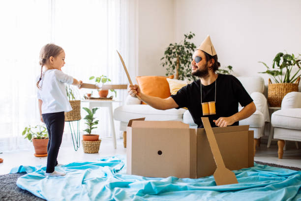 istock Father Playing Exciting Adventure Game With Daughter 1300901730