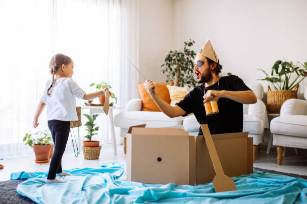 istock Father Playing Exciting Adventure Game With Daughter 1300901810