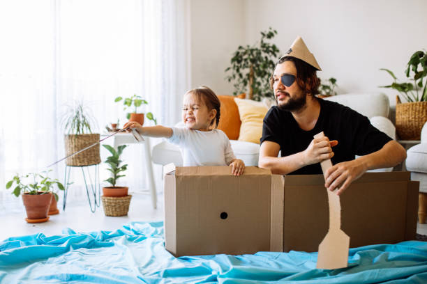 istock Father Playing Exciting Adventure Game With daughter 1300904245